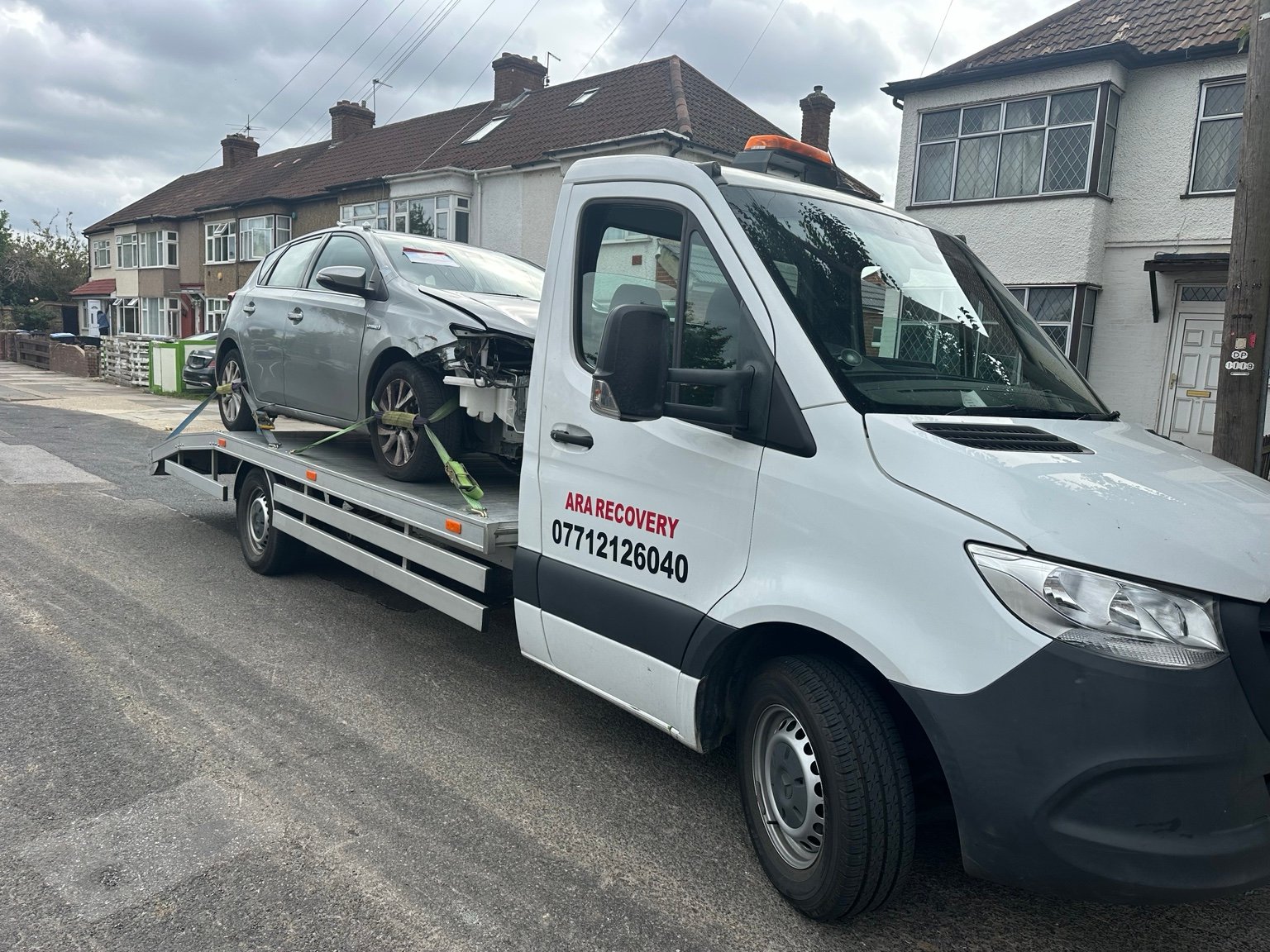 Damaged car transported on an ARA Recovery truck